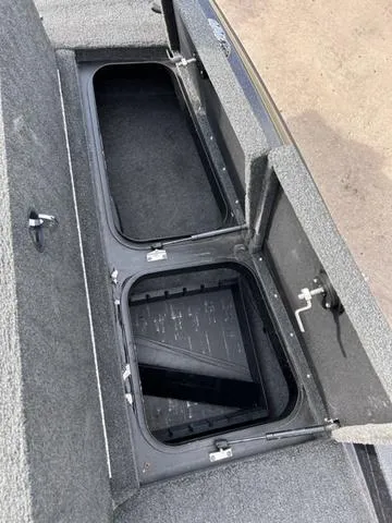 Slide: The Image of Open storage compartments on a 2018 Skeeter ZX250 boat. - 35