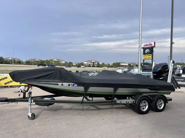 Slide: The Image of 2018 Skeeter ZX250 boat on trailer, covered, parked outdoors. - 42