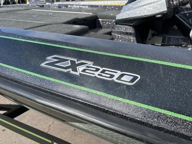 Slide: The Image of 2018 Skeeter ZX250 boat with metallic finish and green accents. - 5