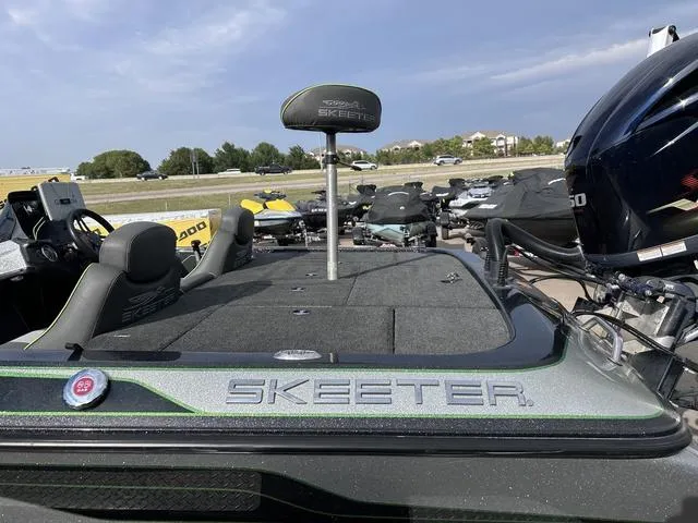Slide: The Image of 2018 Skeeter ZX250 fishing boat with seating and motor, parked outdoors. - 8