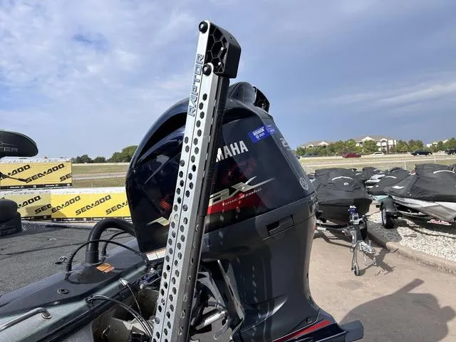 Slide: The Image of 2018 Skeeter ZX250 with Yamaha engine, parked outdoors under a cloudy sky. - 9