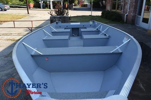 Slide: The Image of 2025 Lund SSV-16 Tiller boat displayed at Thayer's Marine dealership. - 13