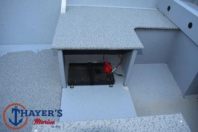 Slide: The Image of 2025 Lund SSV-16 Tiller boat interior with storage compartment and battery. - 15