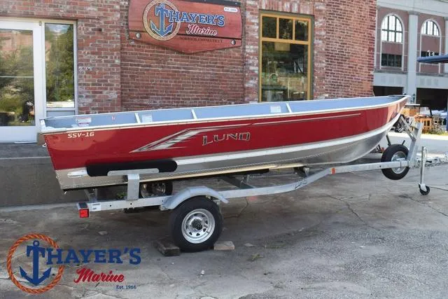 Slide: The Image of 2025 Lund SSV-16 Tiller boat on trailer outside Thayer's Marine. - 21