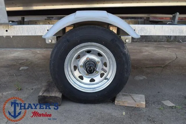 Slide: The Image of Trailer wheel of 2025 Lund SSV-16 Tiller boat at Thayer's Marine. - 6
