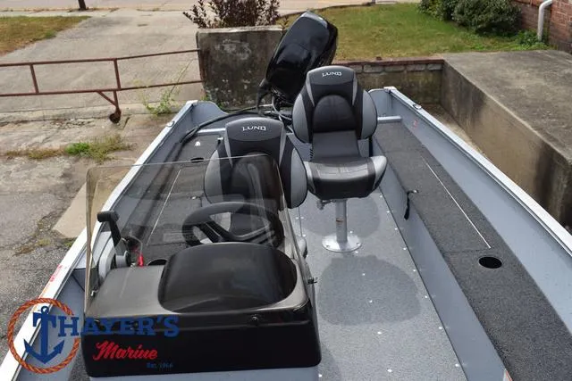 Slide: The Image of 2025 Lund 1600 Fury SS boat interior with seating and steering console. - 18