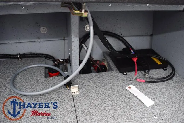 Slide: The Image of 2025 Lund 1600 Fury SS boat interior wiring and battery compartment. - 27