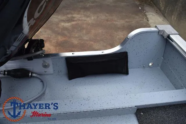 Slide: The Image of 2025 Lund 1600 Fury SS boat interior with Thayer's Marine logo. - 28