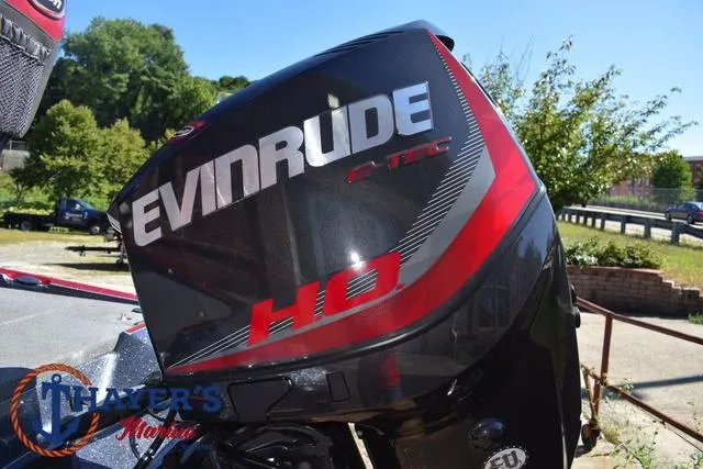 Slide: The Image of Evinrude E-TEC HO engine on 2015 Triton 189 TRX boat, outdoor setting. - 11