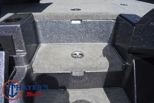 Slide: The Image of 2015 Triton 189 TRX boat interior with carpeted deck and storage compartments. - 19