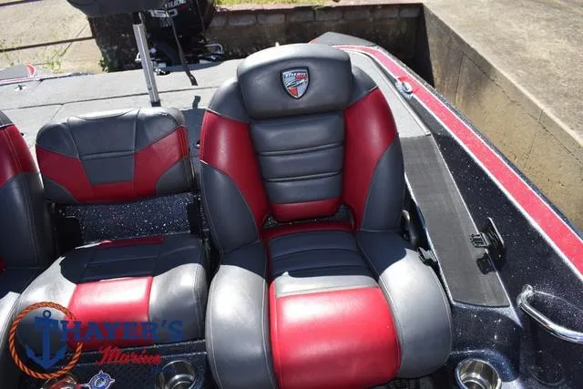 Slide: The Image of 2015 Triton 189 TRX boat seats, red and gray leather, with logo and cup holders. - 23