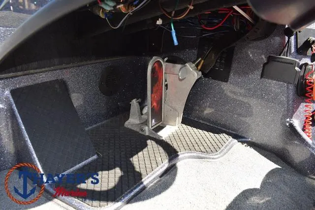 Slide: The Image of 2015 Triton 189 TRX boat interior with foot pedal and wiring. - 29