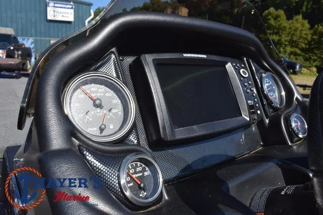 Slide: The Image of Dashboard of a 2015 Triton 189 TRX boat with gauges and a display screen. - 30