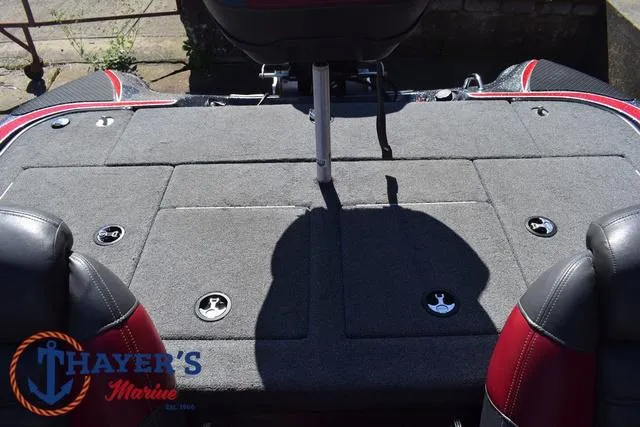 Slide: The Image of 2015 Triton 189 TRX boat deck with storage compartments and seating. - 33