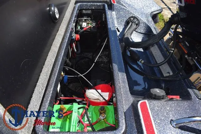 Slide: The Image of 2015 Triton 189 TRX boat battery compartment with wiring and components. - 37
