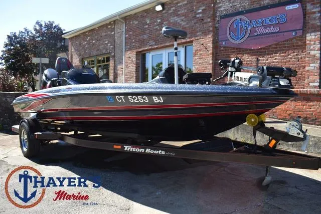 Slide: The Image of 2015 Triton 189 TRX boat on trailer at Thayer's Marine dealership. - 42