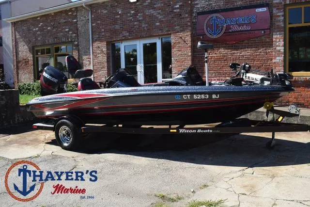 Slide: The Image of 2015 Triton 189 TRX boat at Thayer's Marine dealership, displayed outdoors. - 46