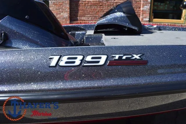 Slide: The Image of 2015 Triton 189 TRX boat with glittery finish, displayed at Thayer's Marine. - 5