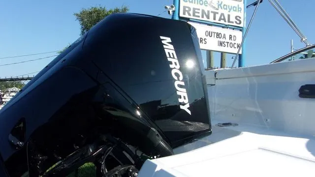 Slide: The Image of 2023 Monterey M-225 boat with Mercury engine near rental sign. - 4