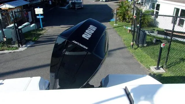 Slide: The Image of 2023 Monterey M-225 boat with Mercury outboard engine in a marina setting. - 5