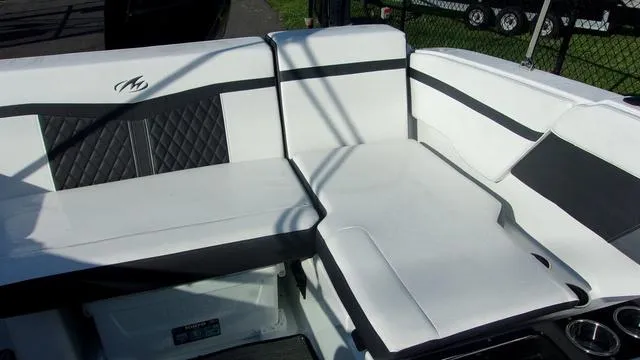 Slide: The Image of 2023 Monterey M-225 boat interior with white and black seating. - 6