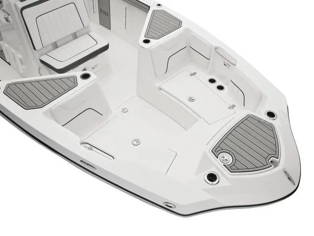 Slide: The Image of 2025 Yamaha Boats 220 FSH Sport, sleek white deck with seating and storage. - 4