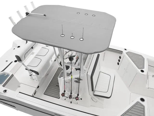 Slide: The Image of 2025 Yamaha Boats 220 FSH Sport, top view, featuring fishing rods and seating. - 9