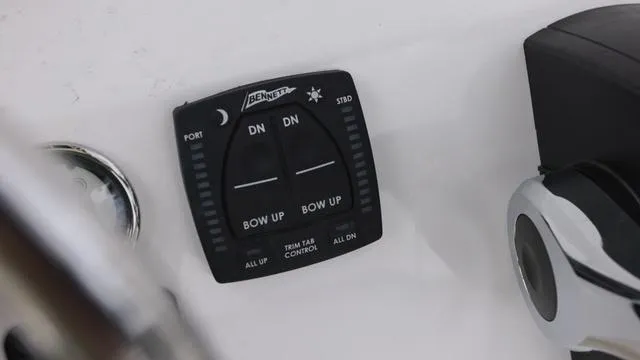 Slide: The Image of Trim tab control panel on 2025 Key West 203 FS boat. - 11