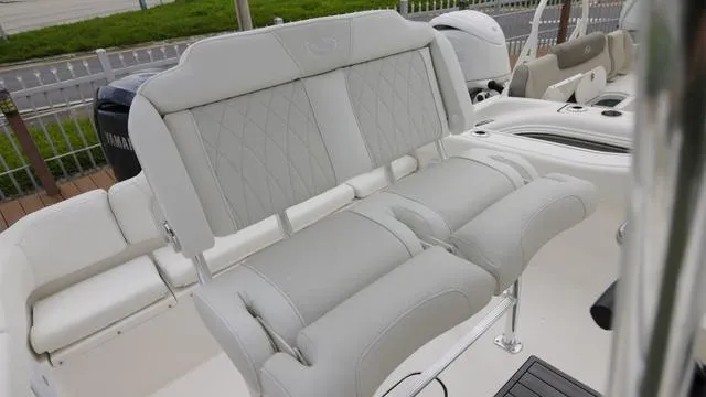 Slide: The Image of 2025 Key West 203 FS boat interior with plush seating and modern design. - 13