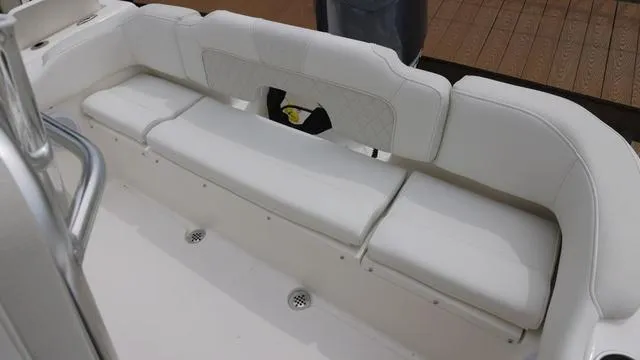 Slide: The Image of 2025 Key West 203 FS boat interior with white cushioned seating. - 6