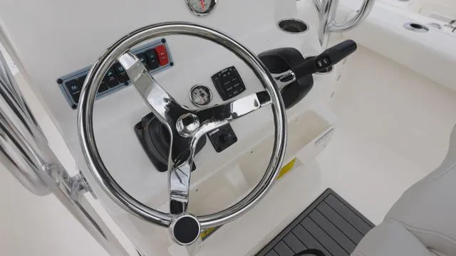 Slide: The Image of 2025 Key West 203 FS boat steering wheel and control panel. - 9