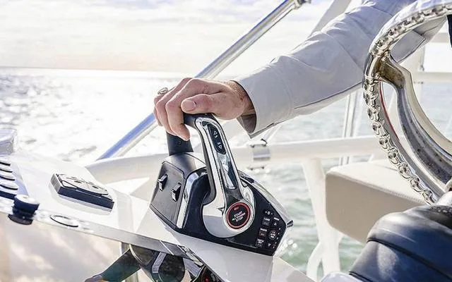 Slide: The Image of Close-up of a 2025 Boston Whaler 365 Conquest throttle control on a sunny day. - 5