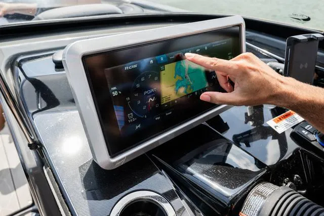 Slide: The Image of Touchscreen navigation on 2025 Yamaha Boats 255XE dashboard. - 5