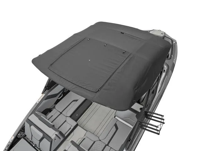 Slide: The Image of 2025 Yamaha Boats 255XE with black canopy and spacious seating. - 7