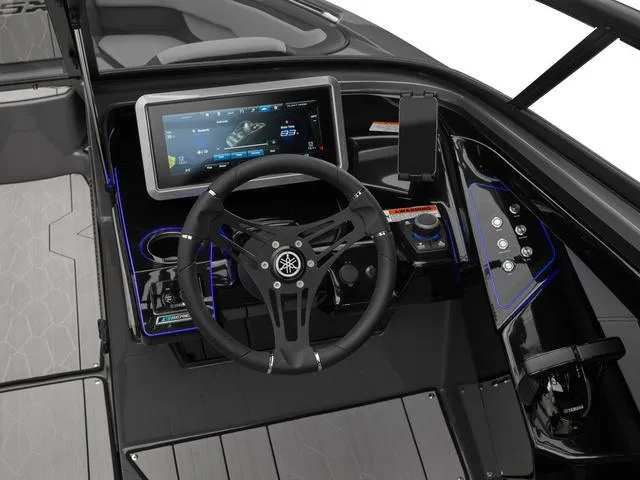 Slide: The Image of 2025 Yamaha Boats 255XE dashboard with touchscreen and steering wheel. - 8