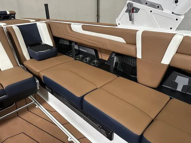 Slide: The Image of 2025 Malibu 25 LSV interior with brown and white leather seating. - 14