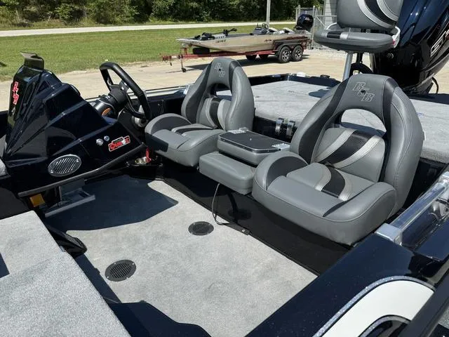 Slide: The Image of 2025 Bass Cat Cougar FTD interior with sleek gray seating and modern dashboard. - 14