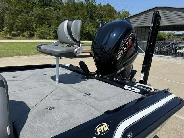 Slide: The Image of 2025 Bass Cat Cougar FTD boat with sleek design and powerful engine. - 15