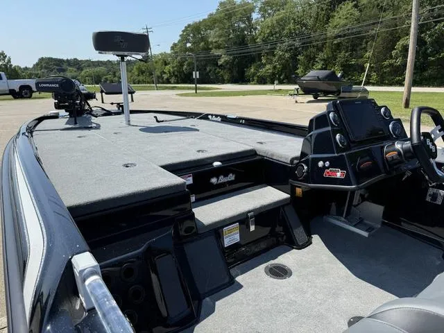 Slide: The Image of 2025 Bass Cat Cougar FTD boat interior with advanced navigation system and spacious deck. - 16