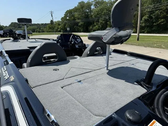 Slide: The Image of 2025 Bass Cat Cougar FTD boat interior with seating and control panel. - 18