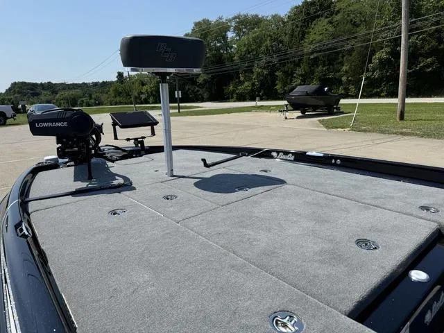 Slide: The Image of 2025 Bass Cat Cougar FTD boat deck with fishing equipment and electronics. - 19