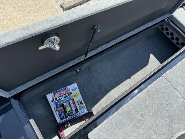 Slide: The Image of Bass Cat Cougar FTD 2025 storage compartment with Lucas Slick Mist detailing kit. - 21