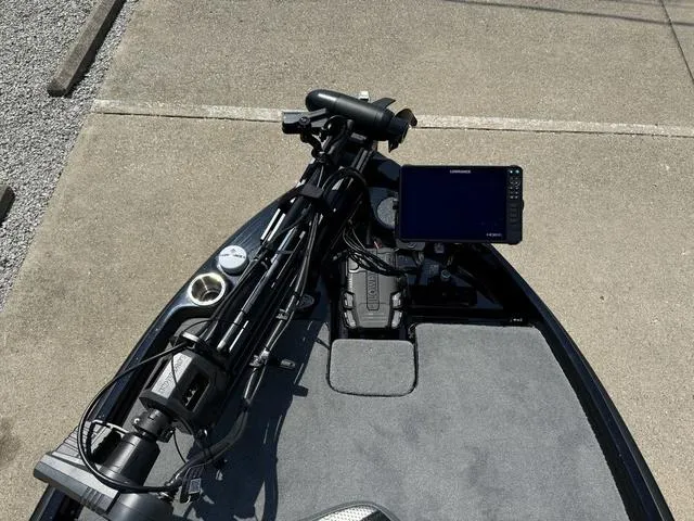 Slide: The Image of 2025 Bass Cat Cougar FTD boat deck with electronics and trolling motor. - 25