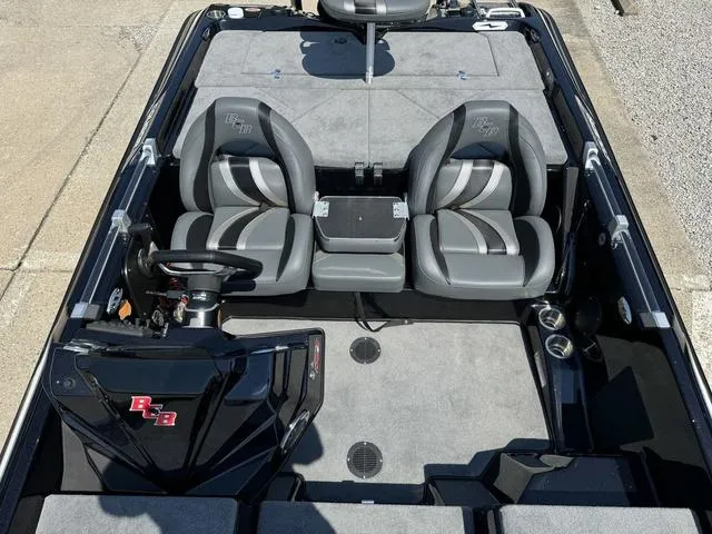 Slide: The Image of 2025 Bass Cat Cougar FTD boat interior with dual seats and steering console. - 26