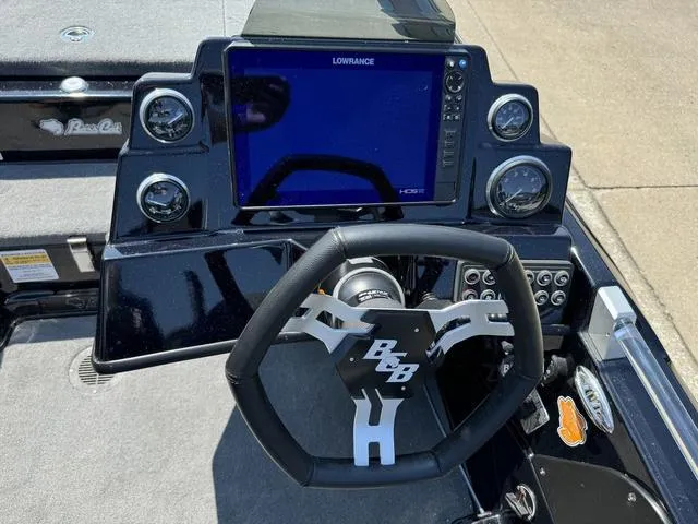 Slide: The Image of Dashboard of 2025 Bass Cat Cougar FTD with Lowrance display and steering wheel. - 28