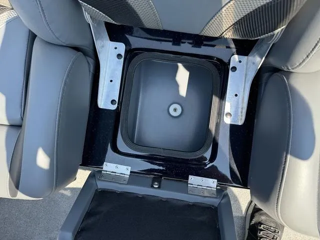 Slide: The Image of 2025 Bass Cat Cougar FTD boat seat storage compartment, open and empty. - 30