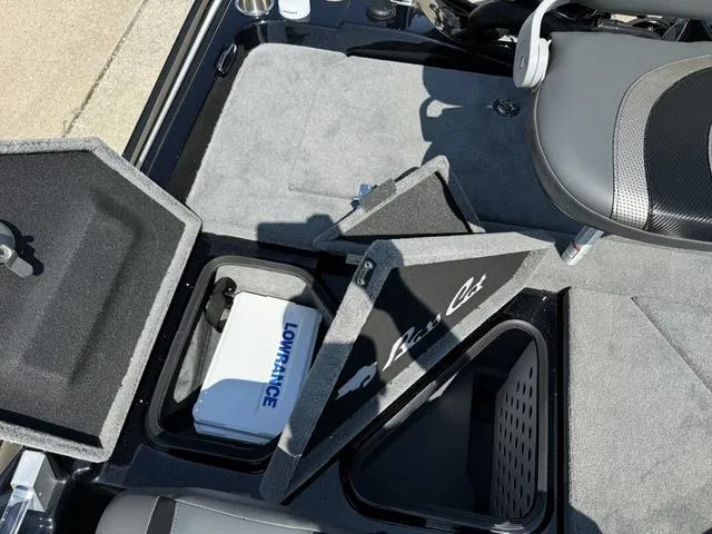 Slide: The Image of 2025 Bass Cat Cougar FTD boat storage compartments with Lowrance equipment. - 34