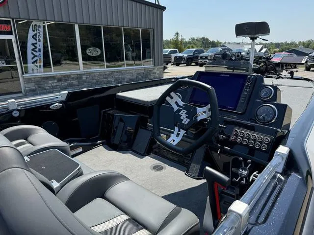 Slide: The Image of 2025 Bass Cat Cougar FTD boat interior with modern dashboard and steering wheel. - 6