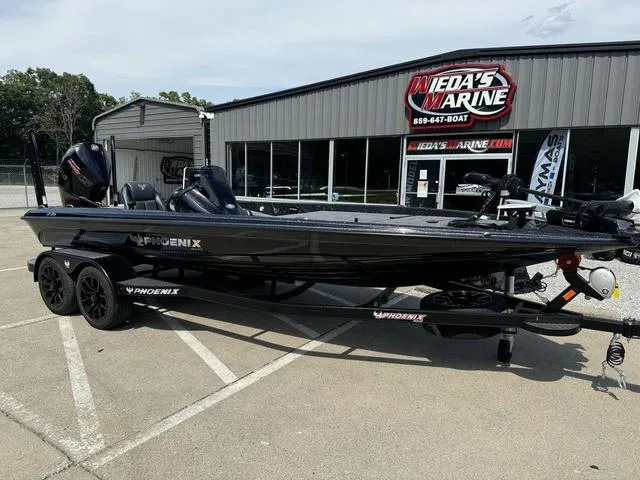 Slide: The Image of 2025 Phoenix 921 ELITE boat at Wieda's Marine dealership. - 12