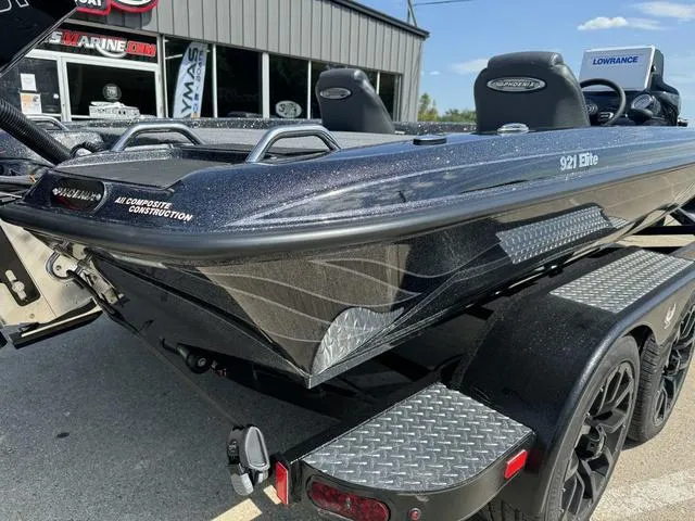 Slide: The Image of 2025 Phoenix 921 ELITE boat, sleek design, all-composite construction, parked on trailer. - 4